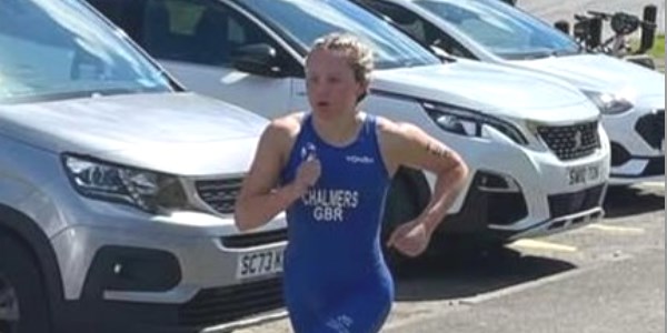 Ella running as part of a Triathlon