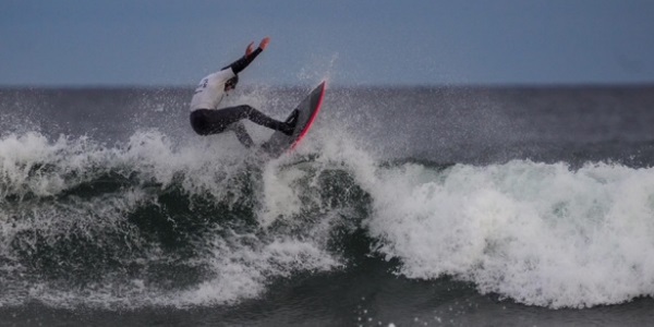 Aidan surfing in the sea