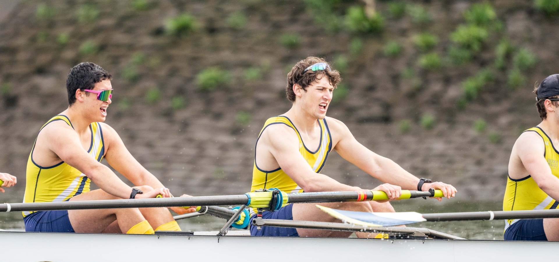 Nathaniel and team mates rowing down the river