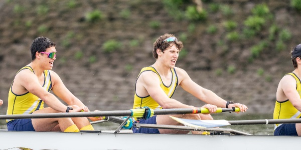 Nathaniel and team mates rowing down the river