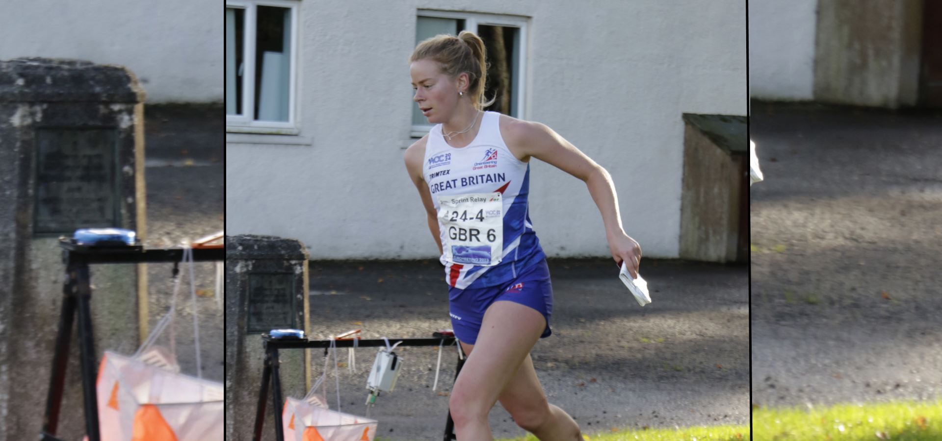 Eilidh running past a house on a street