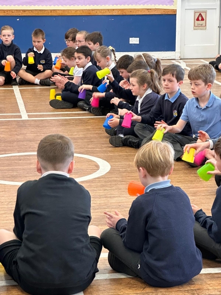 class of children holding instruments