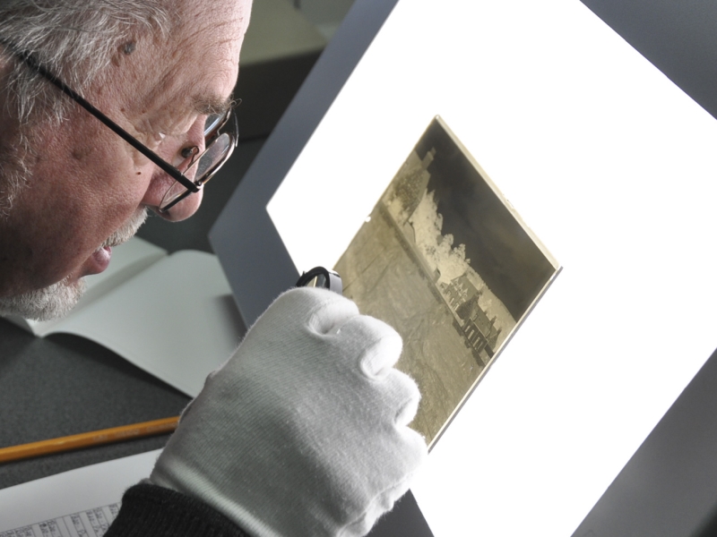 volunteer inspecting photo