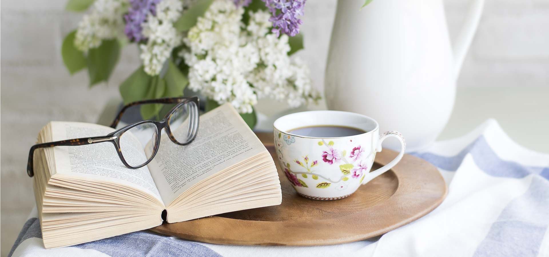 Reading at home with a cup of tea