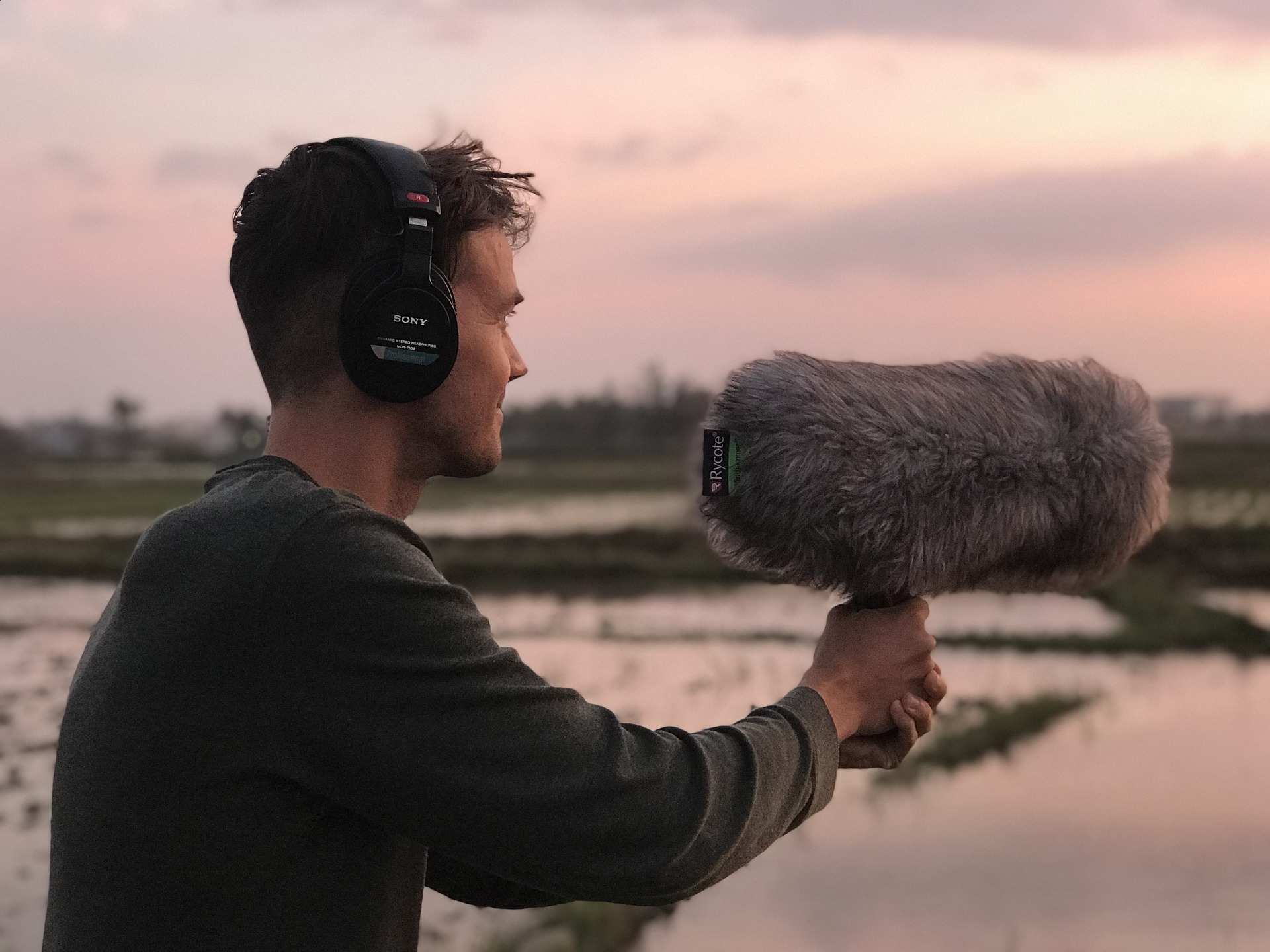 Sound engineer holding microphone