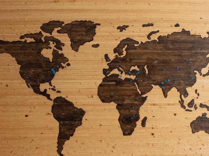 map of the world painted onto a wooden surface