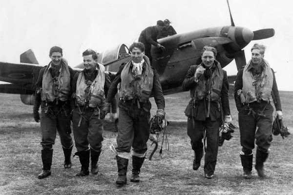 group of pilots walking away from their RAF Mustangs MK3