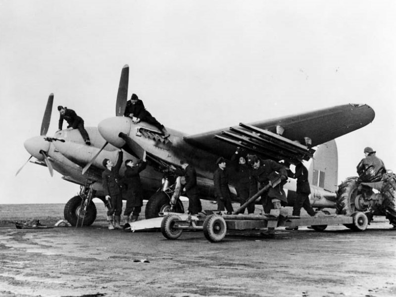 •	A De Havilland Mosquito being armed and made ready with rockets, possibly for an anti-shipping strike in the Norwegian Fiords. RAF Boyndie airfield.