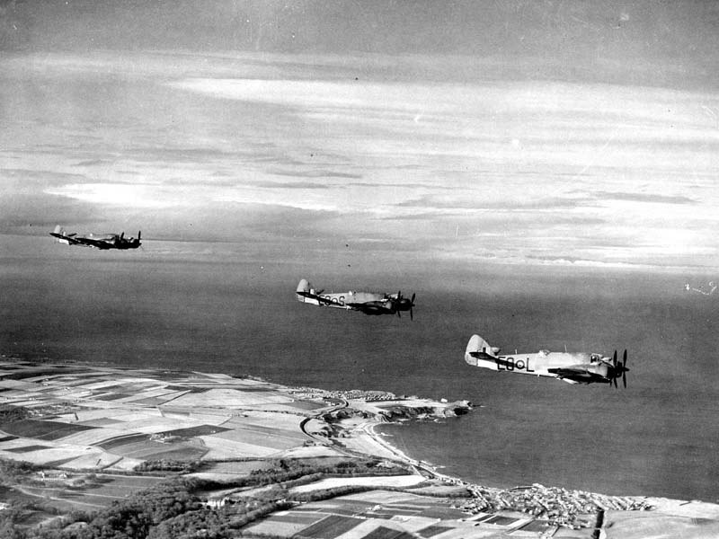 •	Bristol Beaufighters of 404 Squadron when part of the Dallachy Strike Wing in flight over the Banffshire coast early 1945.