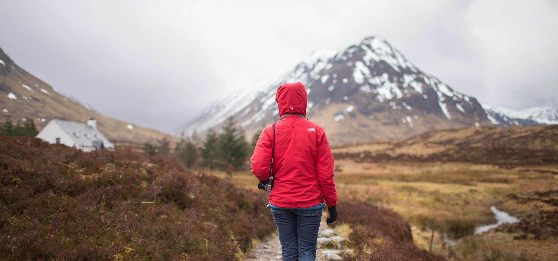 A person hillwalking with the summit in sight