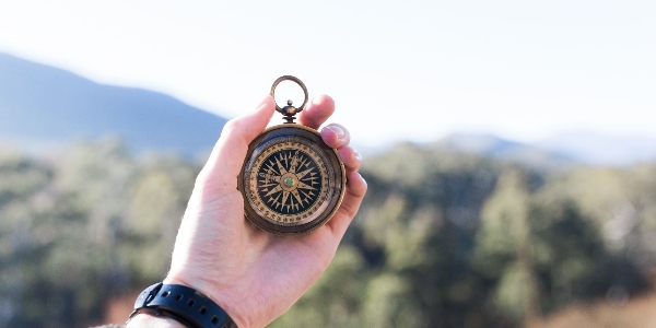 A person holding a compass