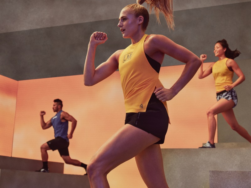 A group of people taking part in a Les Mills exercise class