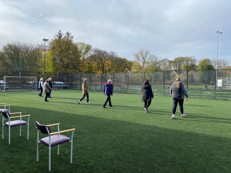 Image shows people walking