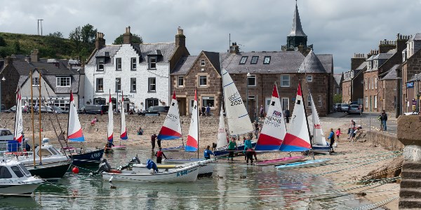 Sailing boats on the shore of Stonehaven Harbour
