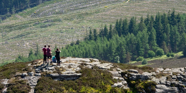 A group of people enjoying the view from the top of an Aberdeenshire hill
