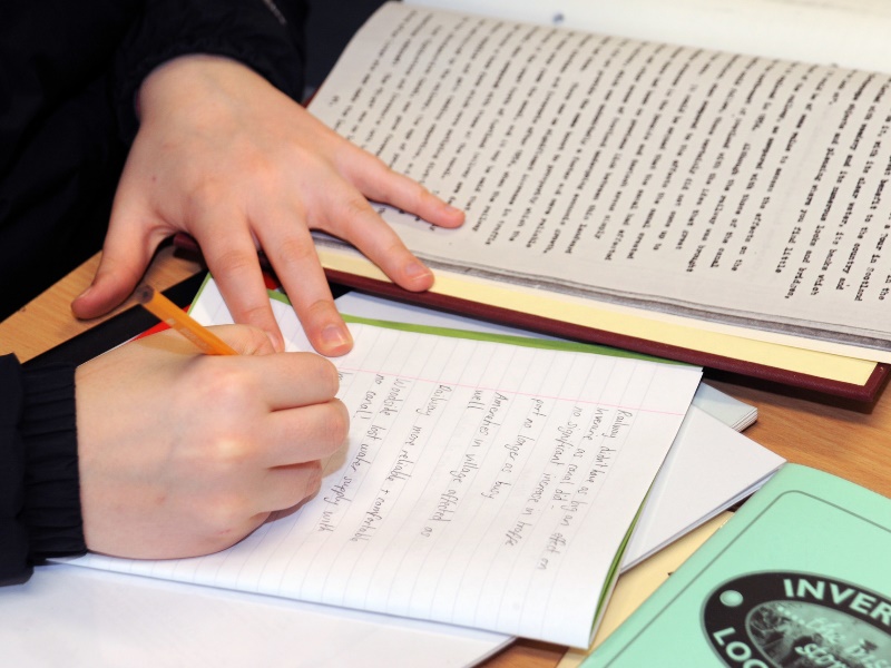 A person taking notes during a research session