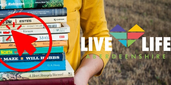 An image of a person holding a bundle of books ready for collection