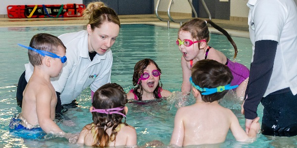 A group of pre-school children enjoying a lesson in the pool