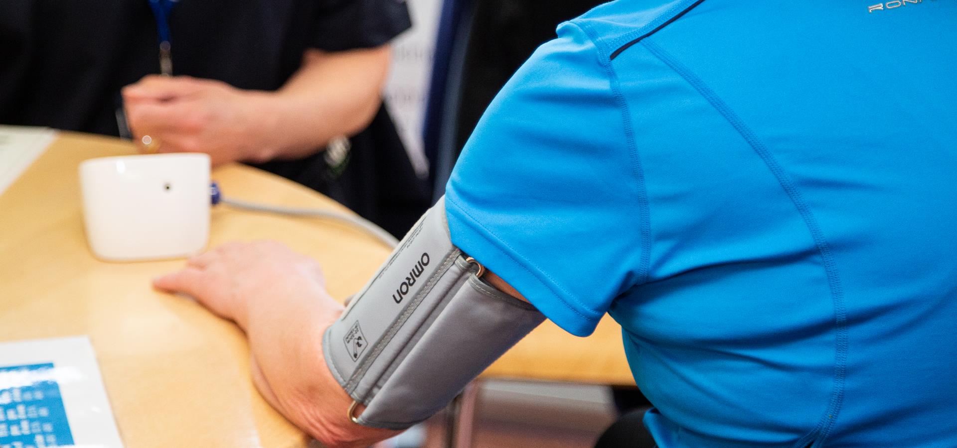 A person getting their blood pressure checked