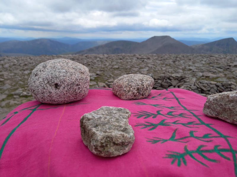 Stones on top of pink cloth