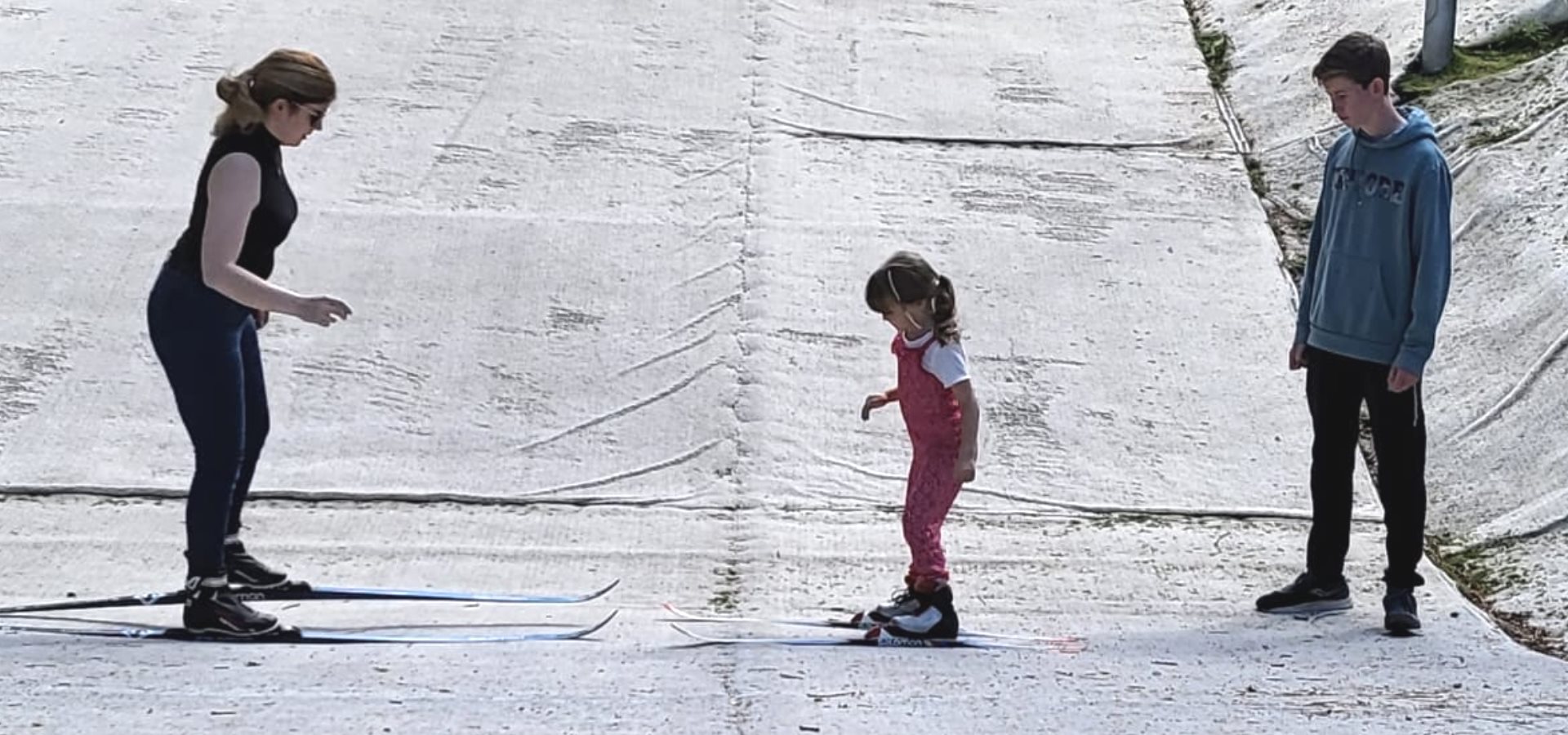 A mother and daughter enjoying a ski session on the dry ski slope