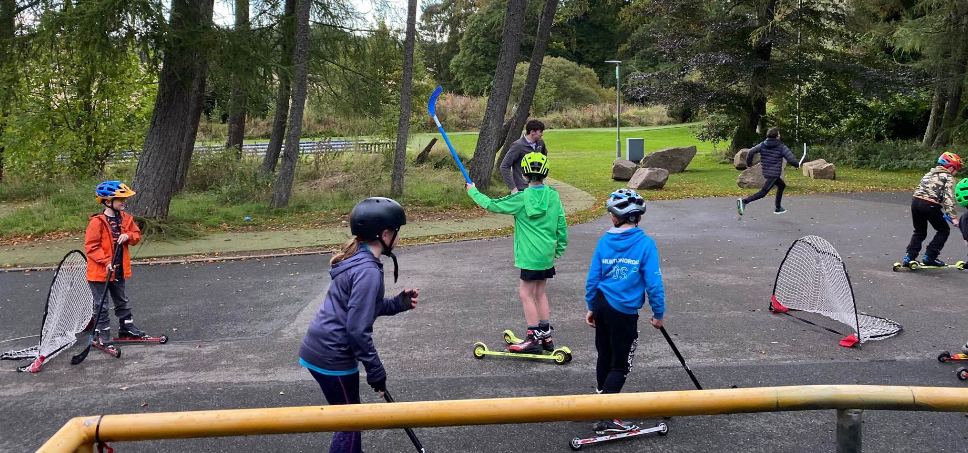 A group of children roller skiing