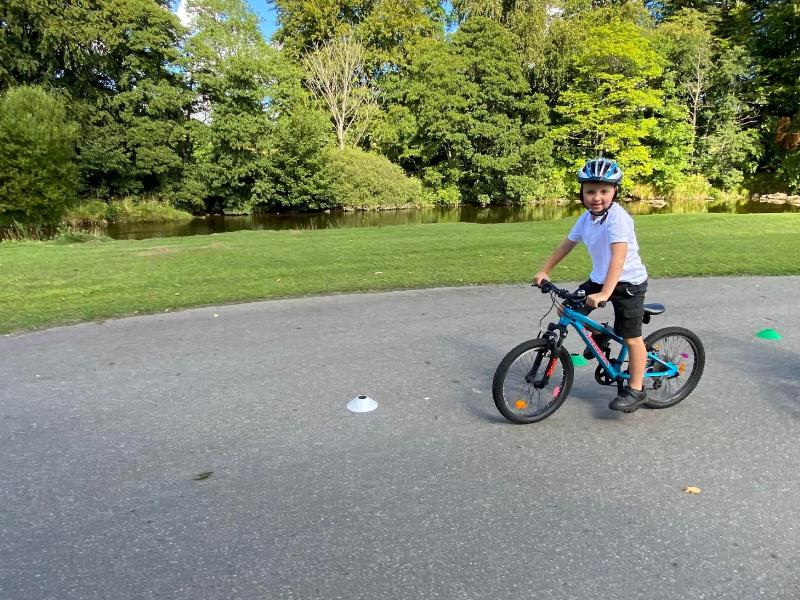 A child cycling outdoors