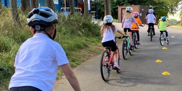 A group of children cycling outdoors