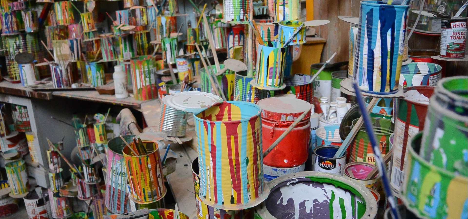 A selection of old colourful paint cans