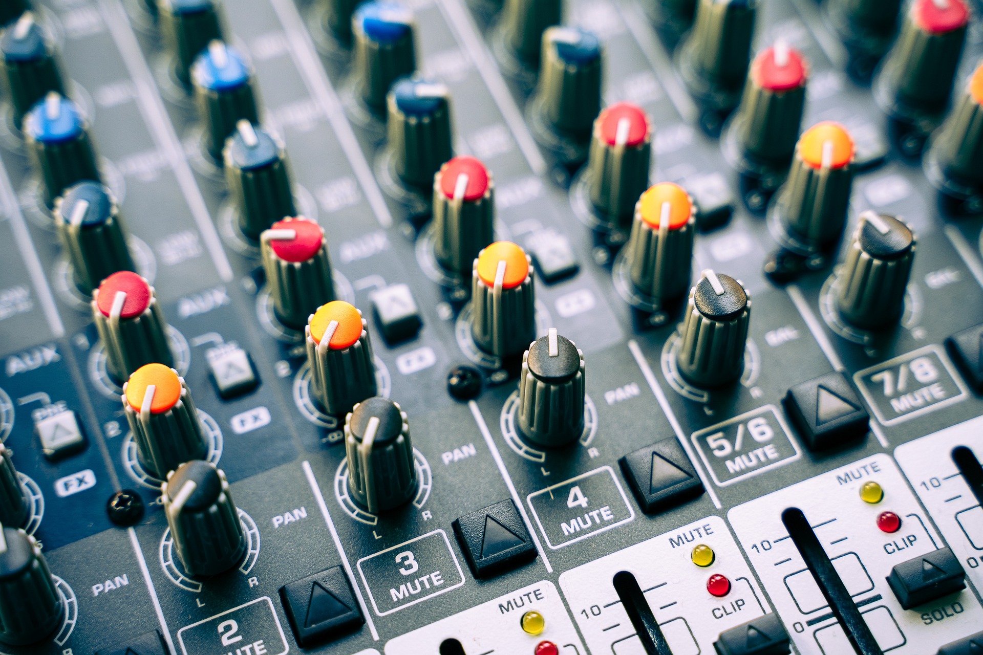 Mixing desk with sliders, knobs, and channel labels