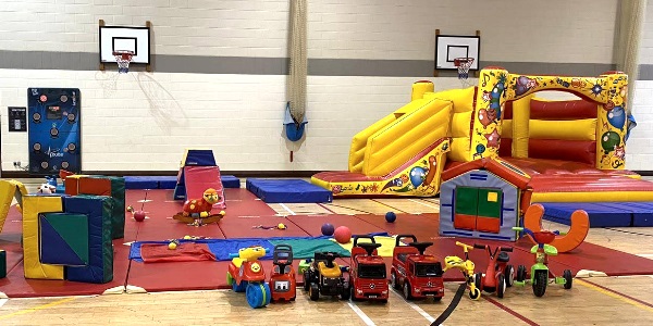 One of our bouncy castles set up with all the soft play equipment around it