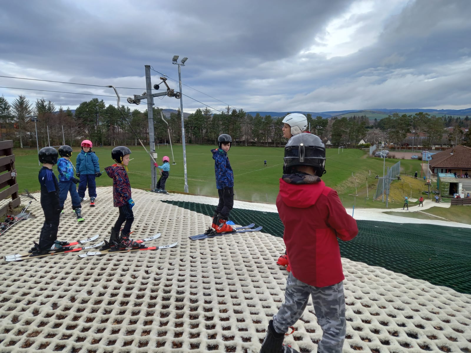 A group of children enjoying a ski lesson