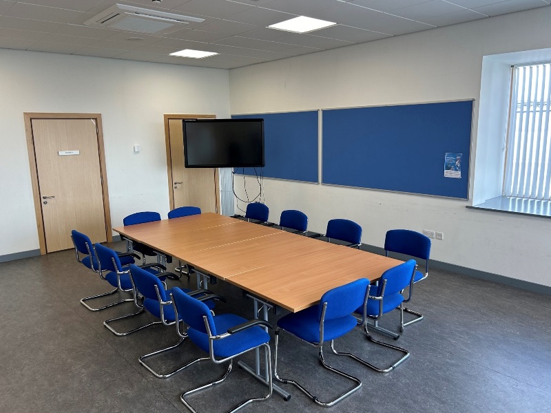 Room 84 with 4 tables and 12 chairs