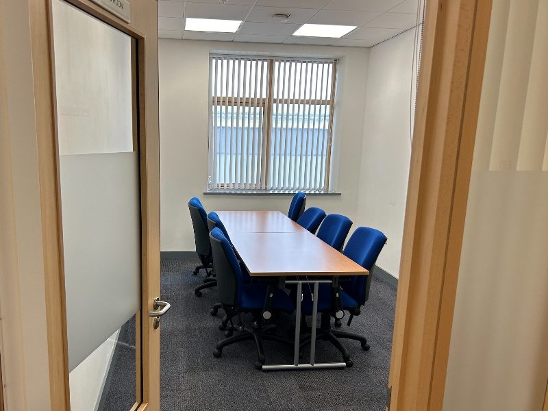 The meeting room at Deveron with 8 chairs and 2 tables